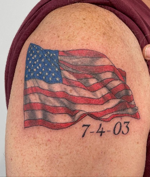 Flowing American Flag Shoulder Tattoo