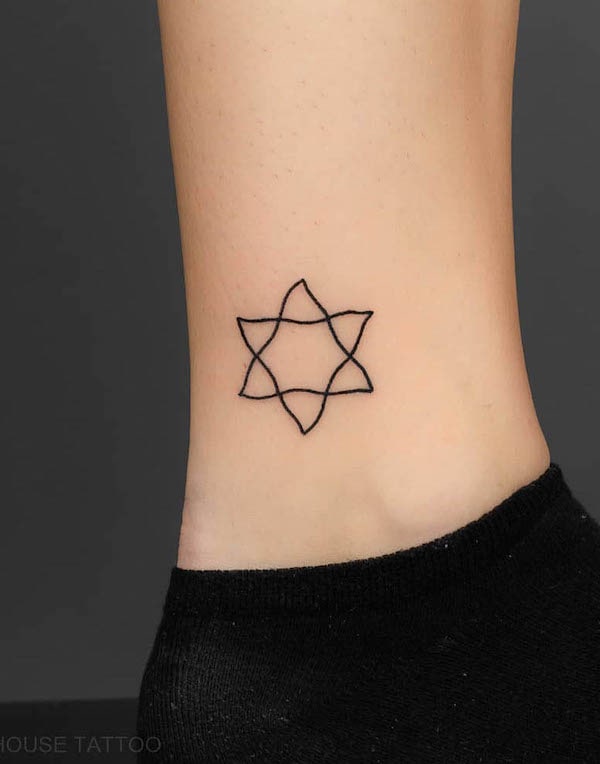 Hand-drawn pentagram ankle tattoo by @blackhousetattoo