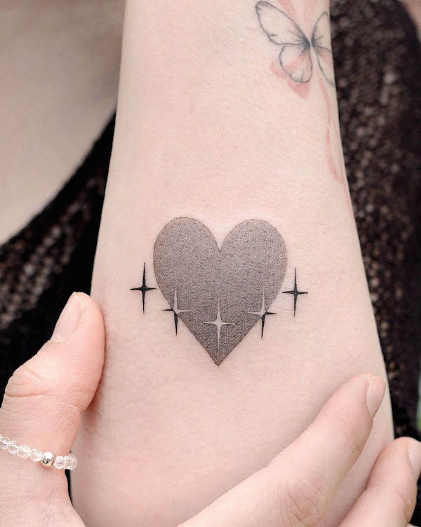 Heart and star tattoo by @choiyun_tattoo