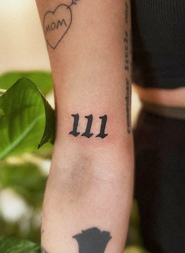 111 angel number tattoo by @blckmorals.ink