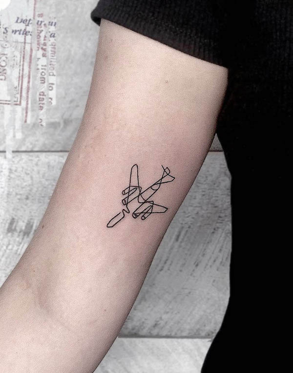 Abstract airplane inner arm tattoo by @couleurgravier