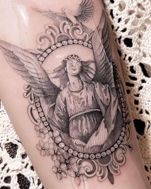 Antique angel tattoo by @dudutattooist