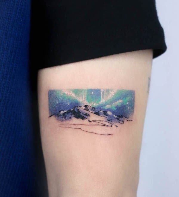 Aurora borealis and mountain tattoo by @soyoon_tt