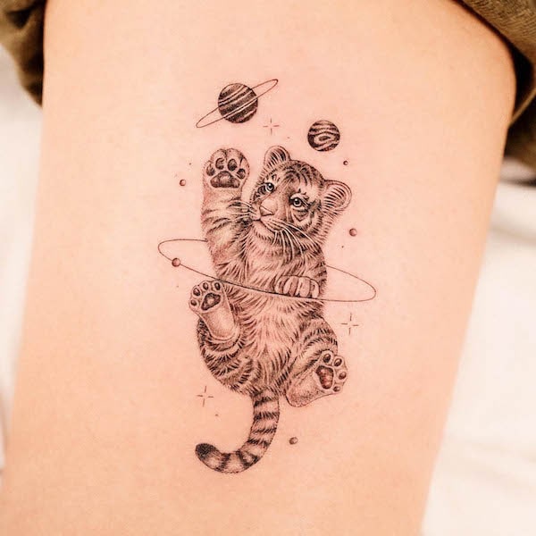 Baby tiger with planets tattoo by @dan_tattooer