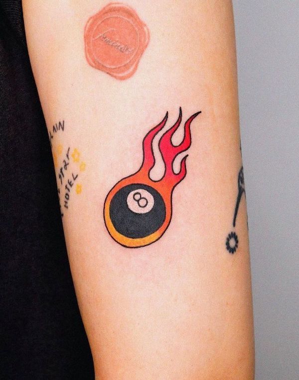 Ball 8 on fire tattoo by @pillow_ink