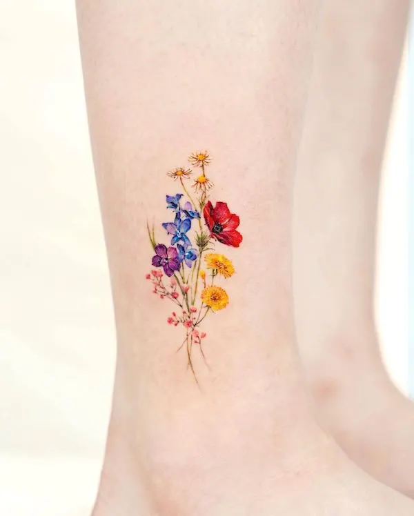 Beautiful bouquet ankle tattoo by @tilda_tattoo