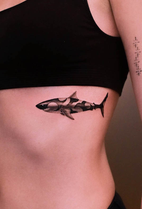 Beautiful shark rib tattoo by @wakki_tattoo