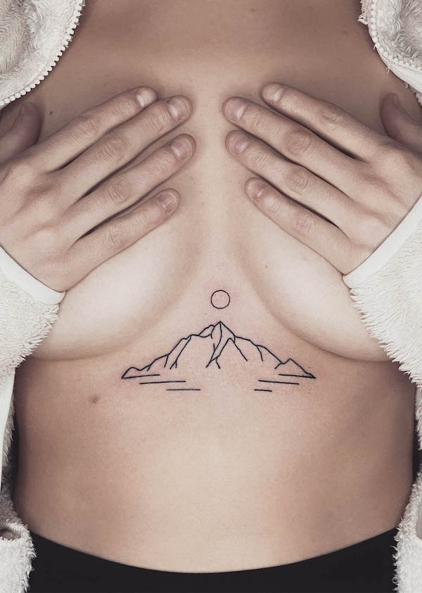 Between the boobs sunrise tattoo by @true_affection_pokes