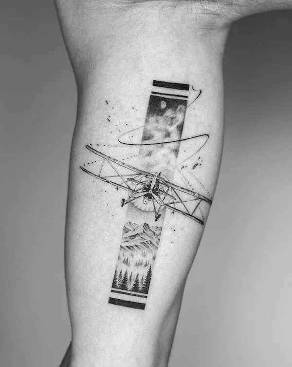 Biplane bicep tattoo by @judz.ttt_