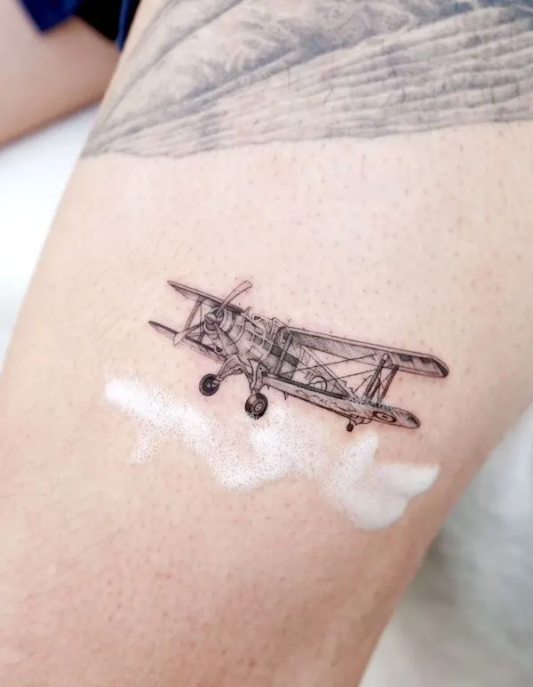 Intricate biplane tattoo by @hansantattoo