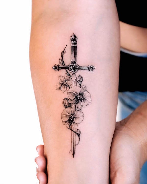 Black and grey sword tattoo by @_rony_tattoo