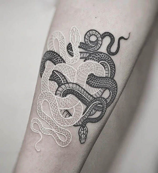 Black and white snake tattoo by @tattoo.concept.arad