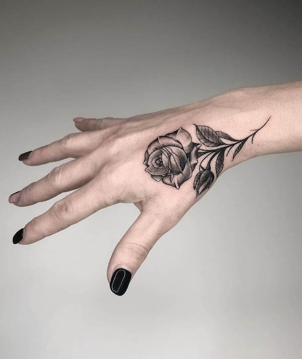 Black rose hand tattoo by @emanuelemasin