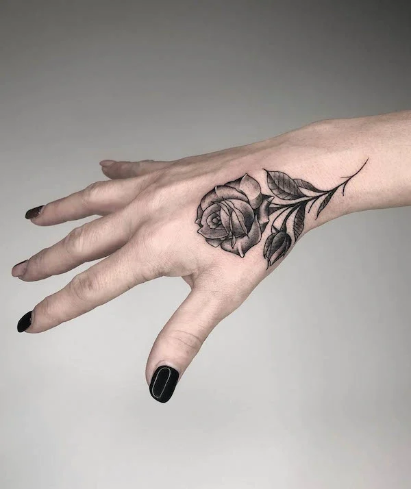 Black rose hand tattoo by @emanuelemasin