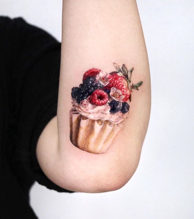 Berry cupcake tattoo on the elbow by @harry_color