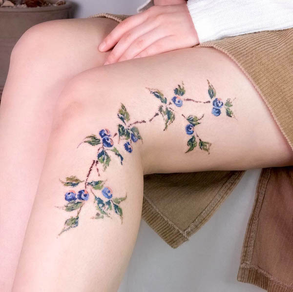 Blueberry leg tattoo for women by @oneultattoo