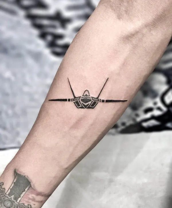 Bold blackwork fighter aircraft tattoo by @tony_tatt