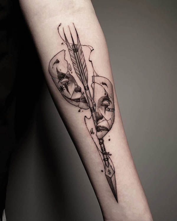 Broken masks arrow tattoo by @birdgod_tattoo