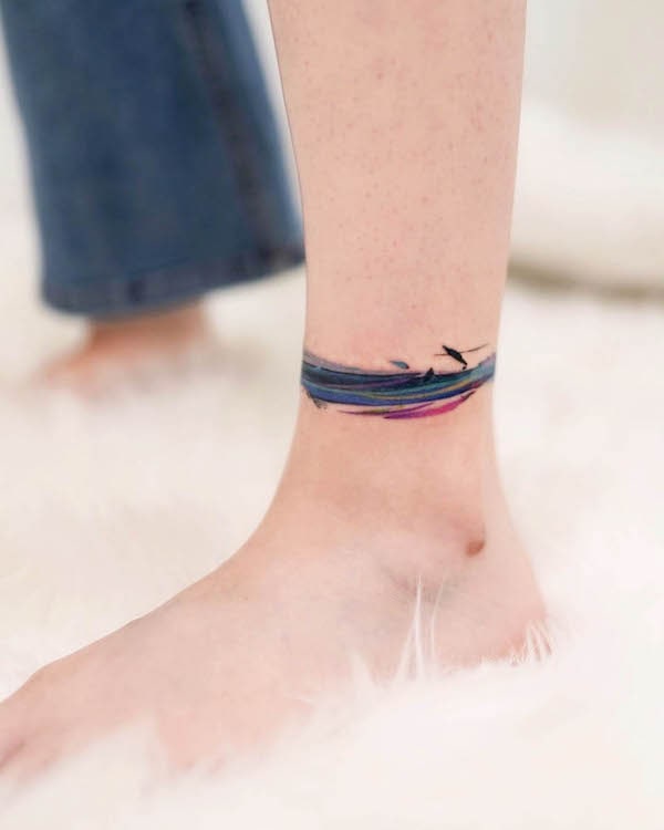 Brushstroke anklet tattoo by @9room_tattoo