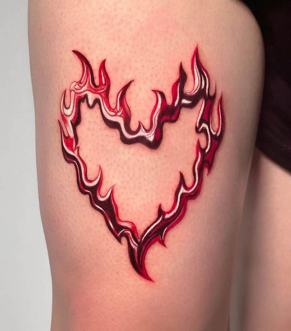 Burning heart thigh tattoo for women by @jenn__contreras