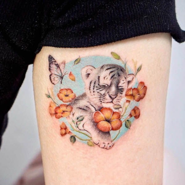 Butterfly and white baby tiger tattoo by @jannabi_tatt