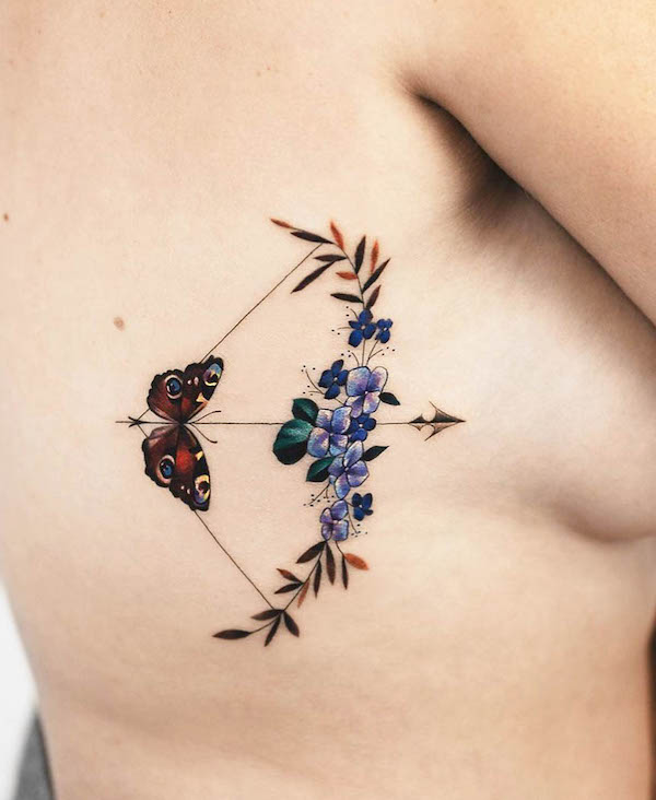 Butterfly arrow rib tattoo by @rey.jasper