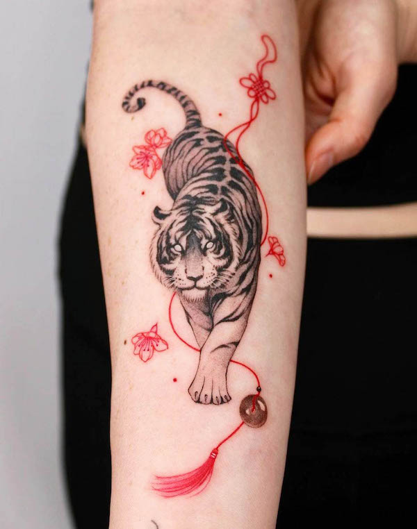 Cherry blossom and tiger tattoo by @sansa.jr_.tattoo