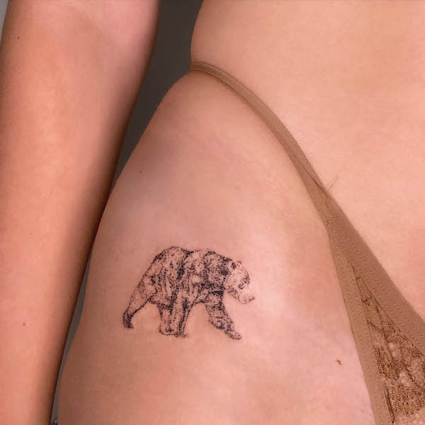 Cover-up bear hip tattoo by @hadleygrass