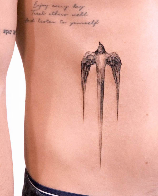 Creative swallow dagger tattoo by @ghinkos