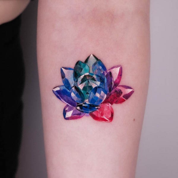 Crystal lotus forearm tattoo by @tattooist_coldy