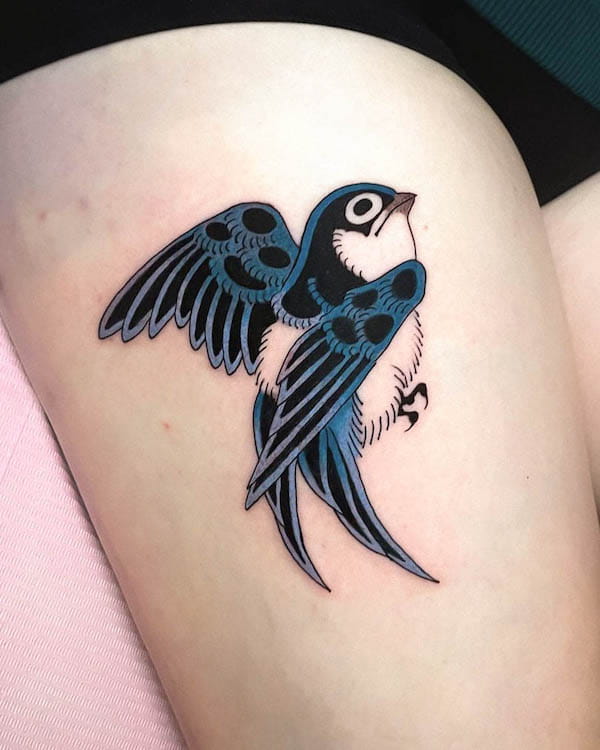 Cute blue swallow thigh tattoo by @jadie.tattoos