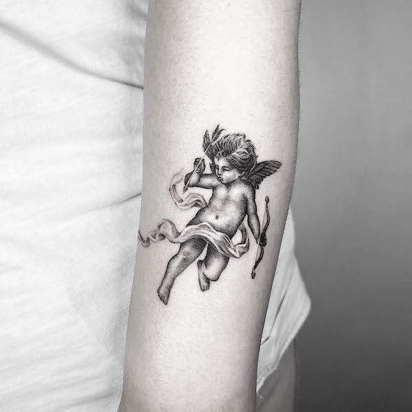 Cute cherub tattoo by @deos__tt