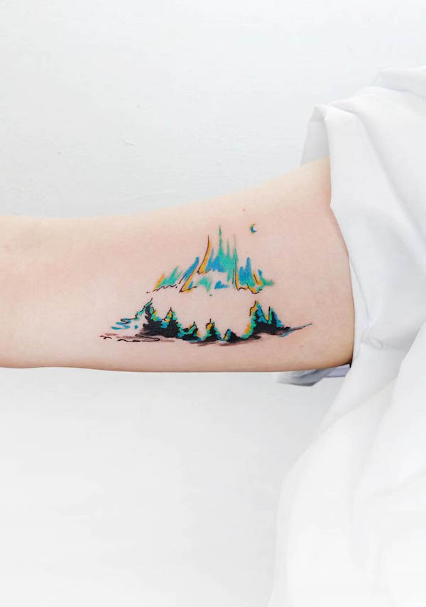 Cute mountain bicep tattoo by @tattooist_baran_