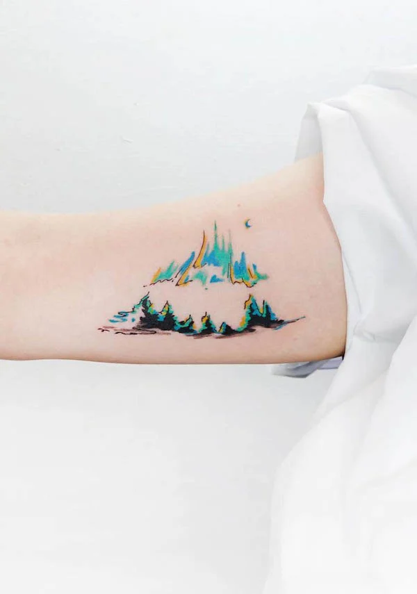 Cute mountain bicep tattoo by @tattooist_baran_