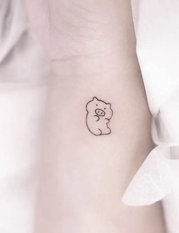 Cute piggy wrist tattoo by @element_inker