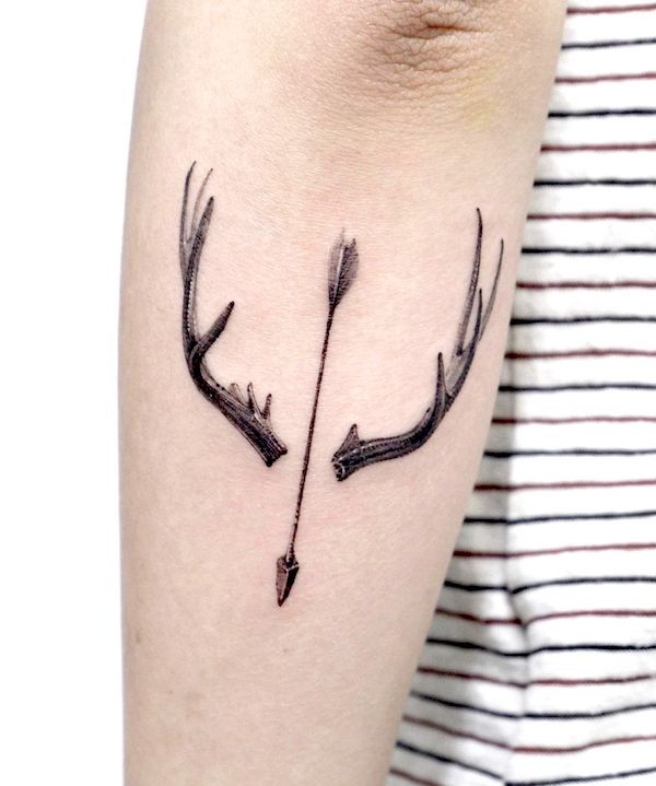 Deer antler and arrow tattoo by @ati.ful