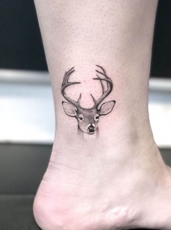 Deer head ankle tattoo by @juliahardtattoo