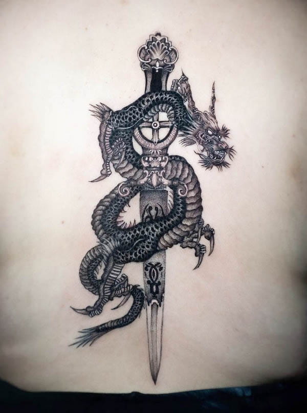 Detailed oriental dragon and dagger tattoo by @crazeekidtattoo