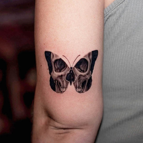 Devil butterfly elbow tattoo by @tatu_panda