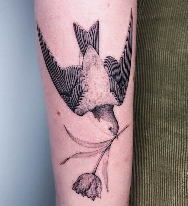 Diving swallow with flower tattoo by @heloisegeslain