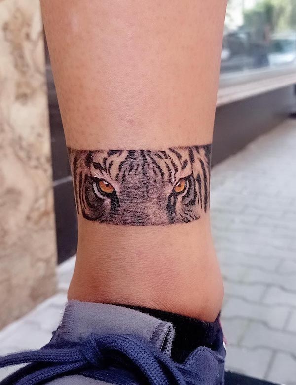 Eyes of tiger ankle tattoo by @angel.s_tatt