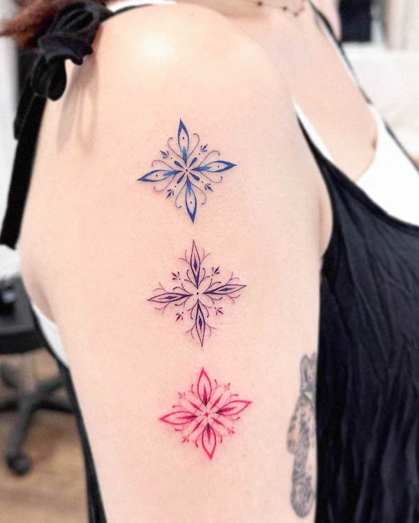 Fine line snowflakes by @e.hyang_.tattoo