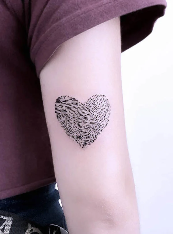 Fingerprint heart tattoo by @pulsar.tattoo