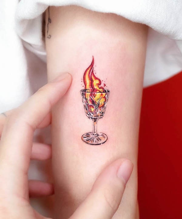 Fire in a glass tattoo by @soosoo.tattoo