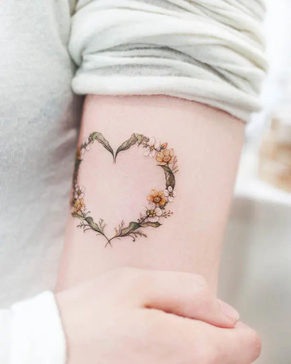 Floral wreath heart tattoo by @tattoo.haneul