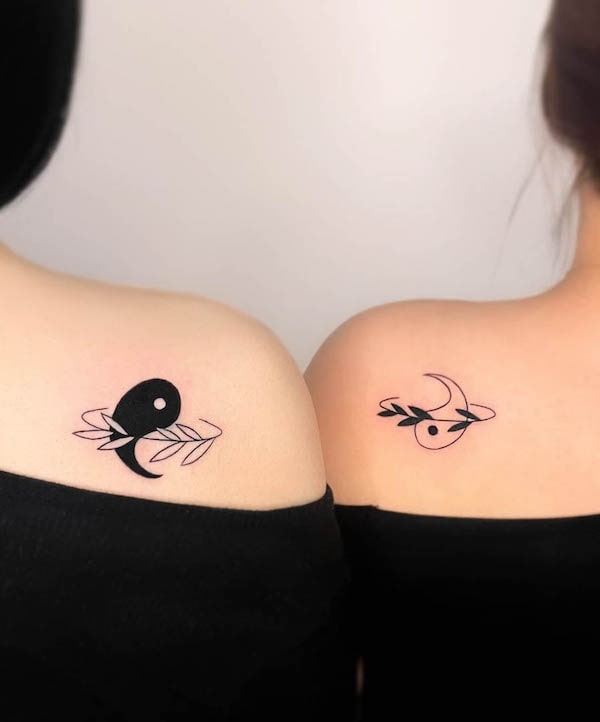 Floral yin yang tattoos for sisters by @mauve_tattooer