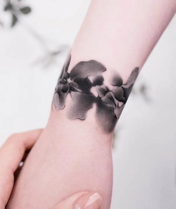 Flow of ink bracelet tattoo by @liang.ink