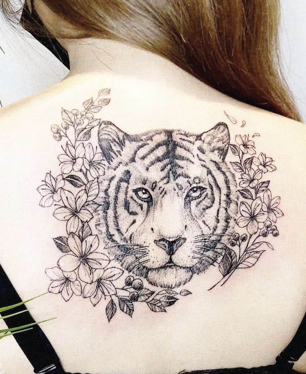 Flowers and tiger back tattoo by @rahee.tt_