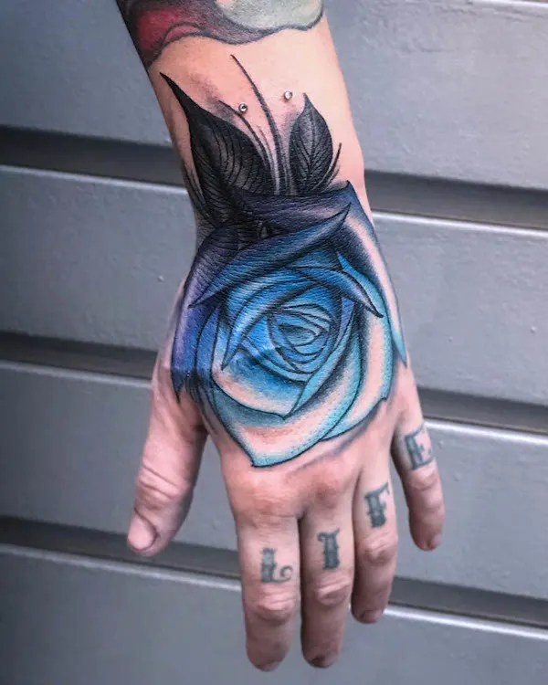 Full hand blue rose tattoo by @damianmltattoo