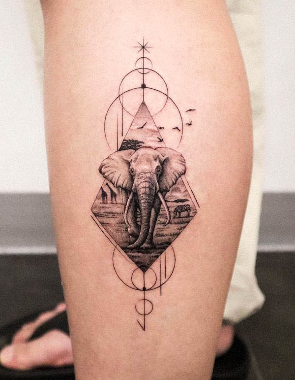 Circles and arrow elephant tattoo by @tattooist_jaeo